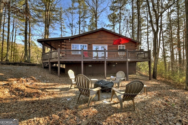 back of property with a wooden deck