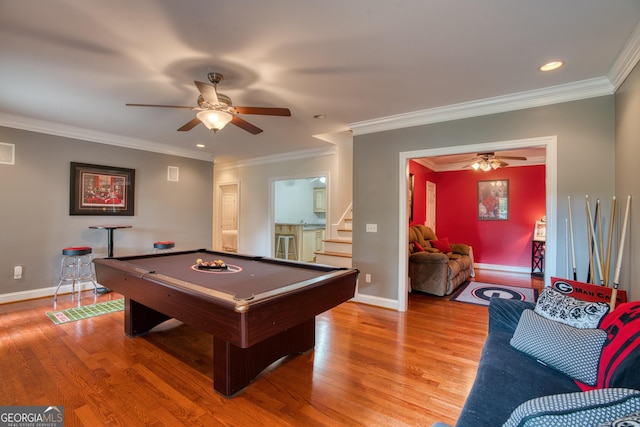 game room with pool table, ornamental molding, ceiling fan, and light wood-type flooring