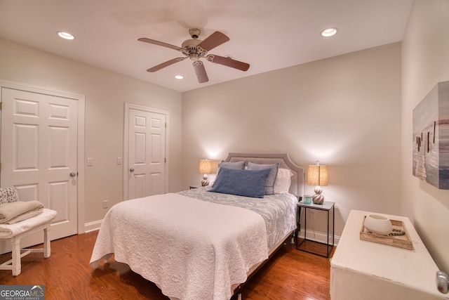 bedroom with hardwood / wood-style flooring and ceiling fan