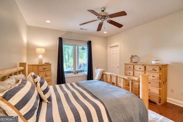 bedroom featuring dark wood-type flooring and ceiling fan