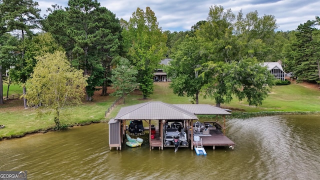 view of dock featuring a water view and a yard