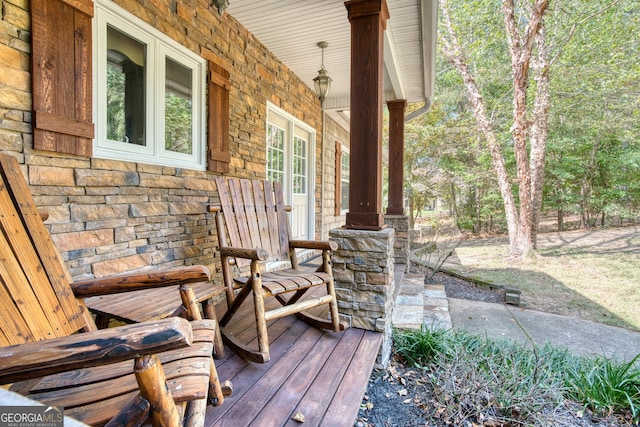 wooden deck featuring covered porch