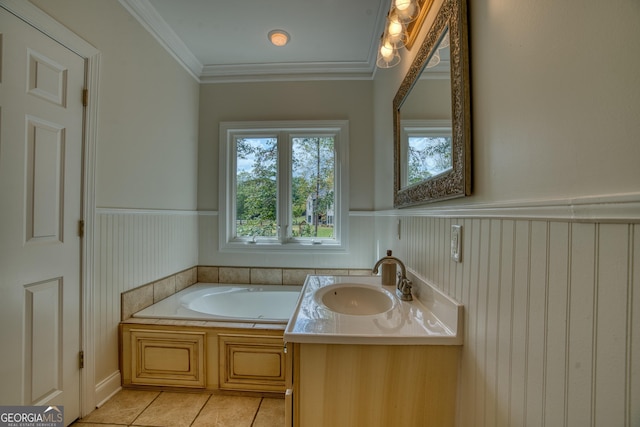 bathroom with tile patterned flooring, vanity, crown molding, and a tub