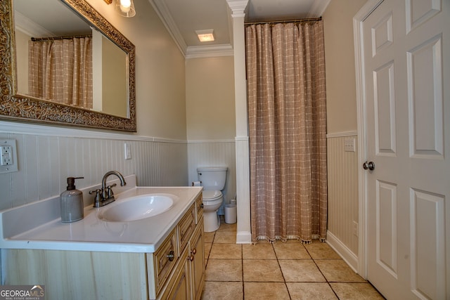 bathroom featuring crown molding, tile patterned floors, toilet, and vanity