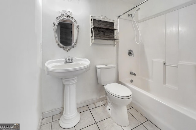 bathroom with toilet, tile patterned flooring, and shower / bathing tub combination