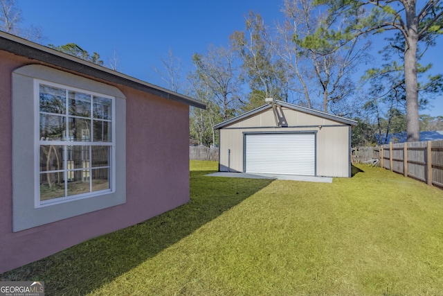 garage featuring a yard