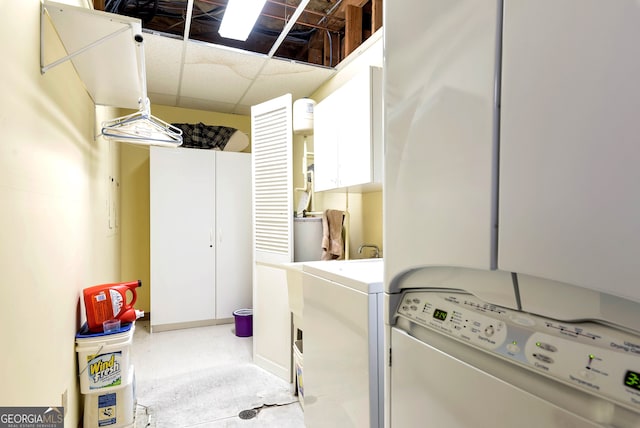 laundry area featuring cabinets and separate washer and dryer