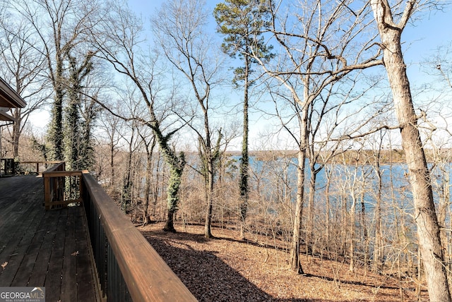 wooden deck featuring a water view