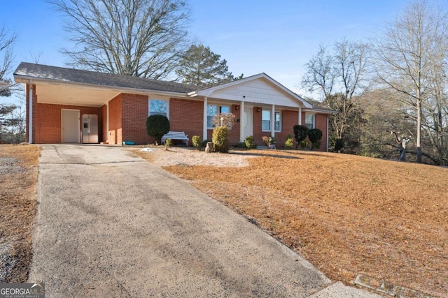 ranch-style house featuring a carport