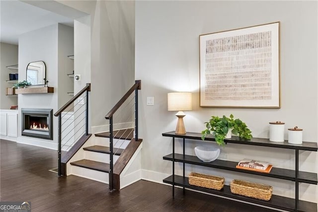 stairway featuring hardwood / wood-style floors