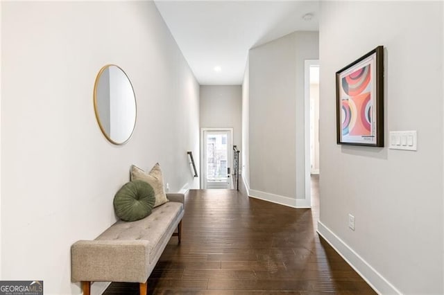 hallway with dark wood-type flooring