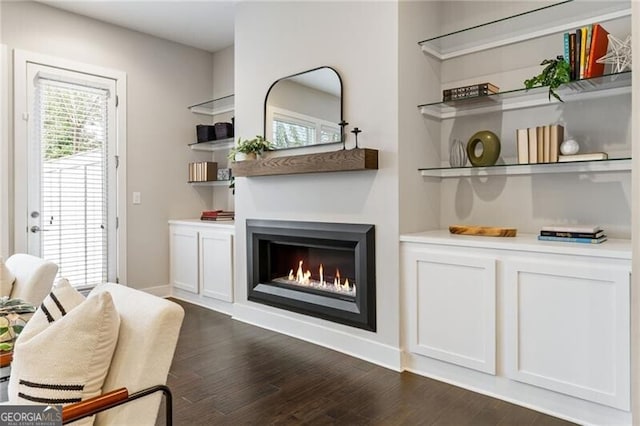 bar with white cabinetry and dark hardwood / wood-style flooring