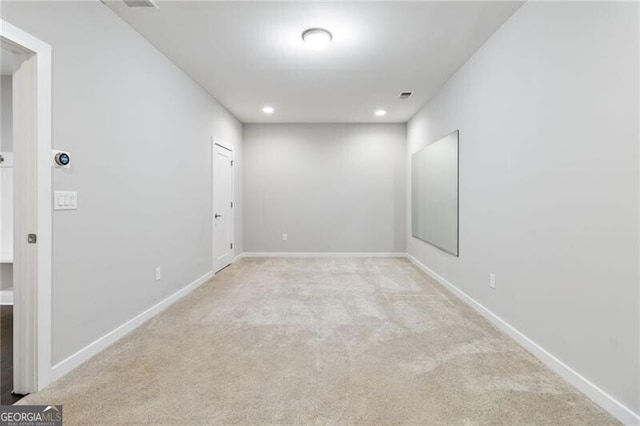 empty room with light colored carpet