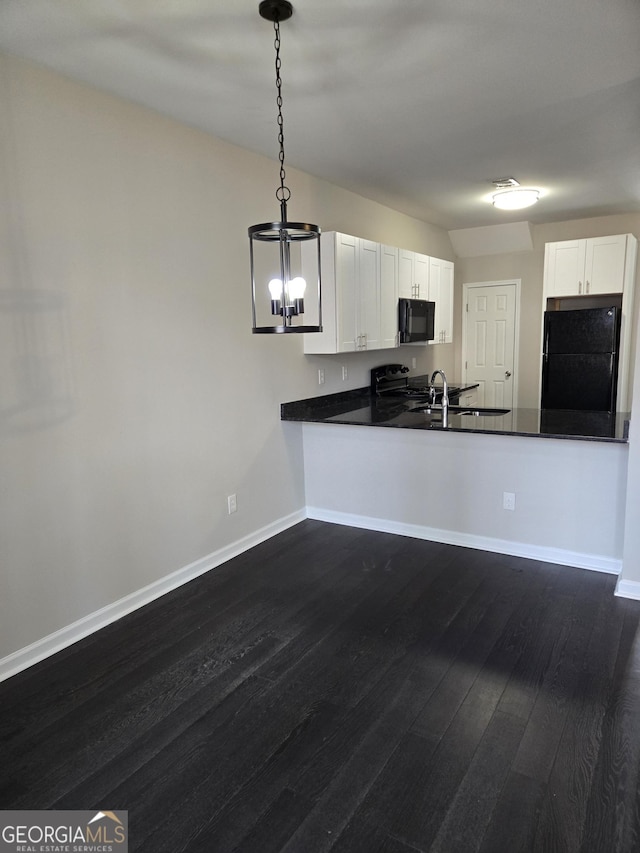 kitchen featuring dark hardwood / wood-style floors, white cabinets, decorative light fixtures, and black appliances