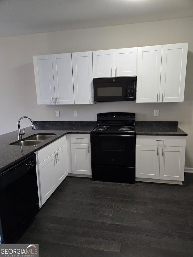 kitchen with white cabinetry, sink, dark wood-type flooring, and black appliances