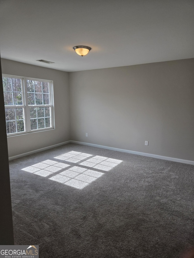 unfurnished room with carpet flooring