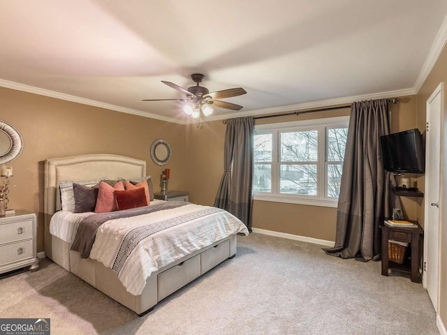 bedroom with baseboards, a ceiling fan, carpet flooring, and crown molding