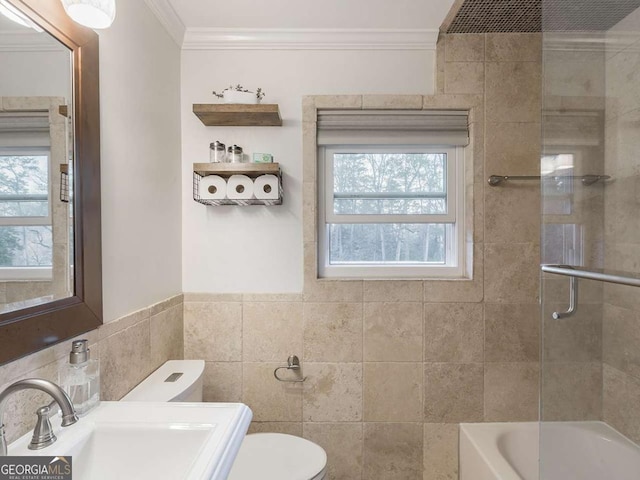 full bath featuring a sink, toilet, a healthy amount of sunlight, and ornamental molding