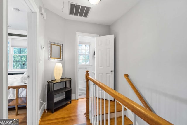 hallway with light hardwood / wood-style flooring