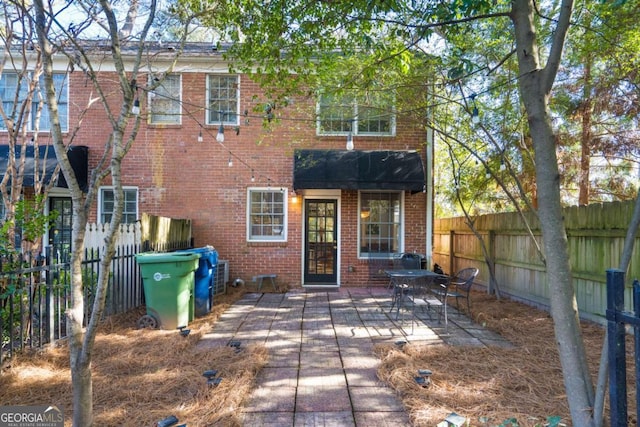 back of house featuring a patio area