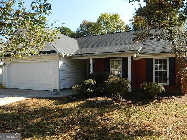 single story home featuring a garage