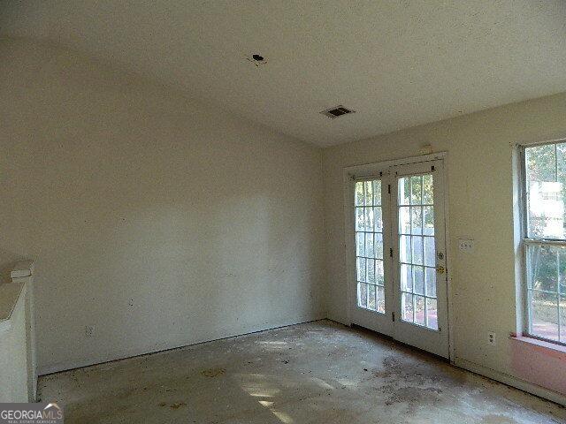 unfurnished room with plenty of natural light