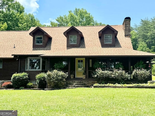 cape cod home featuring a porch and a front yard