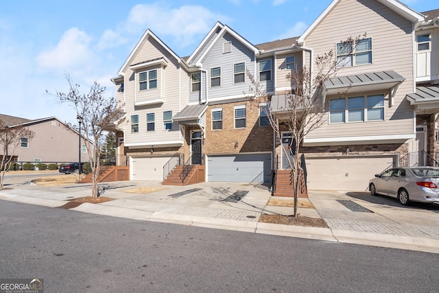 multi unit property featuring a garage