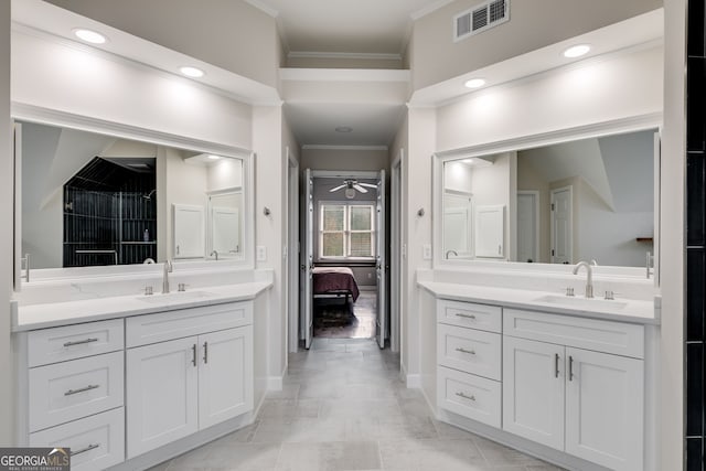 bathroom with ornamental molding, vanity, and ceiling fan