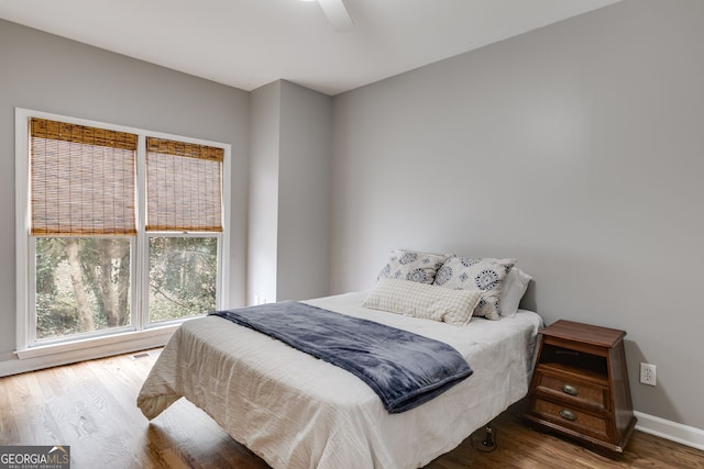 bedroom featuring hardwood / wood-style flooring and ceiling fan