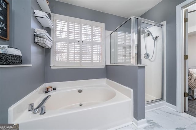 bathroom with shower with separate bathtub