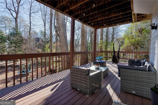 wooden deck featuring an outdoor hangout area