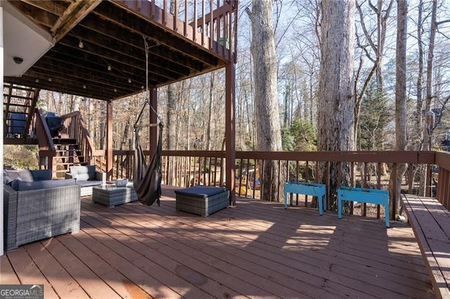 wooden terrace featuring an outdoor hangout area