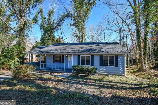 ranch-style home featuring a porch