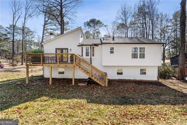 back of property featuring a wooden deck