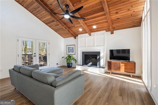 living room featuring french doors, wood ceiling, wood-type flooring, and beamed ceiling