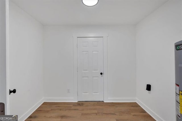 spare room with wood-type flooring