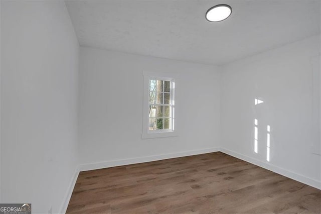 unfurnished room featuring hardwood / wood-style floors