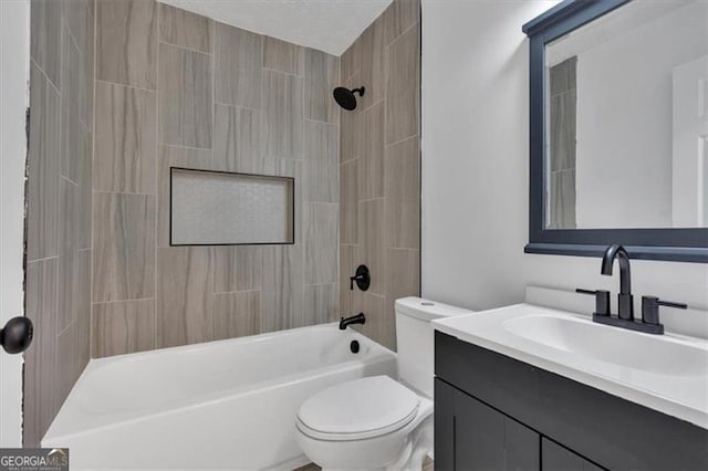 full bathroom with tiled shower / bath combo, vanity, and toilet