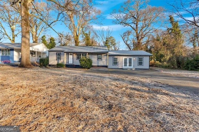 ranch-style home with a front lawn