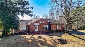 ranch-style house with a front lawn