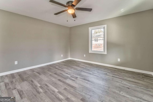 unfurnished room featuring light hardwood / wood-style flooring and ceiling fan