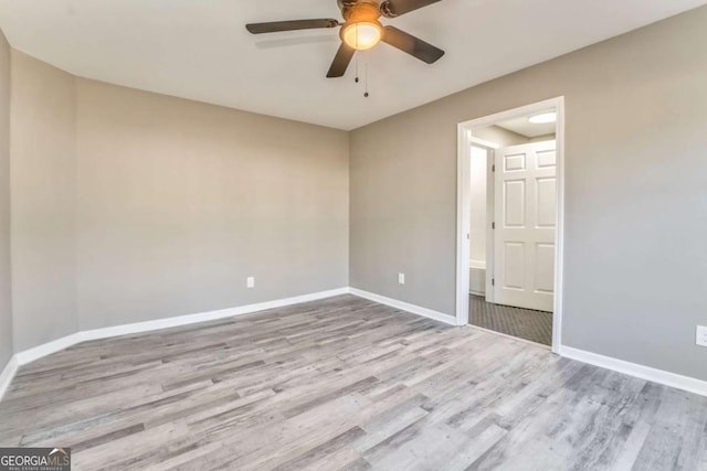 unfurnished room with ceiling fan and light hardwood / wood-style floors