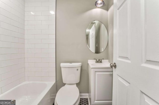 full bathroom with vanity, tiled shower / bath, and toilet