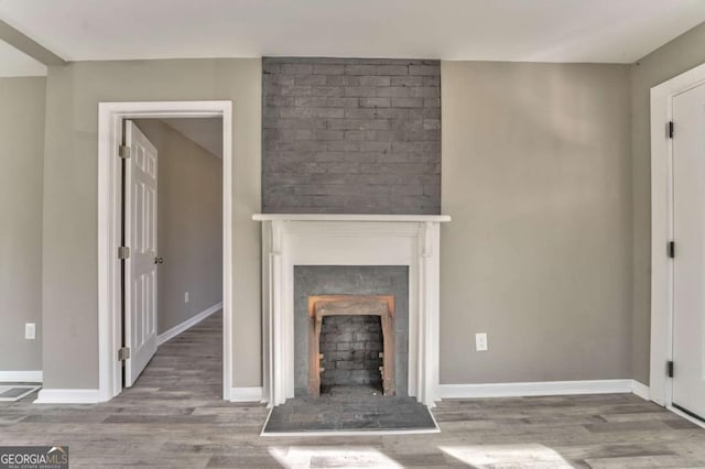 unfurnished living room with hardwood / wood-style floors