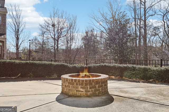 view of patio featuring an outdoor fire pit