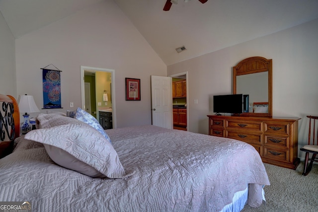 carpeted bedroom featuring ensuite bath, high vaulted ceiling, and ceiling fan