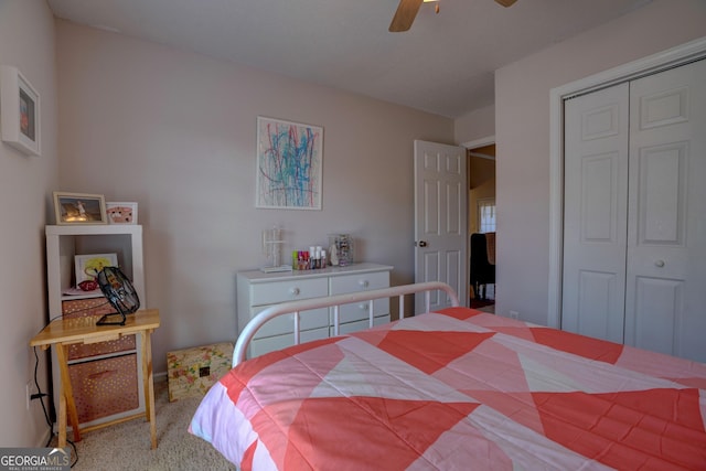 carpeted bedroom featuring a closet and ceiling fan