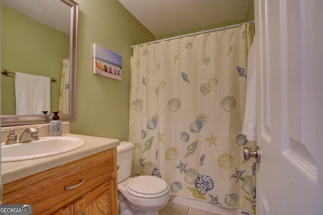 bathroom with vanity, tile patterned floors, a textured ceiling, and toilet