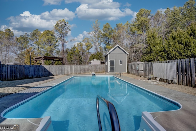 view of swimming pool featuring an outdoor structure